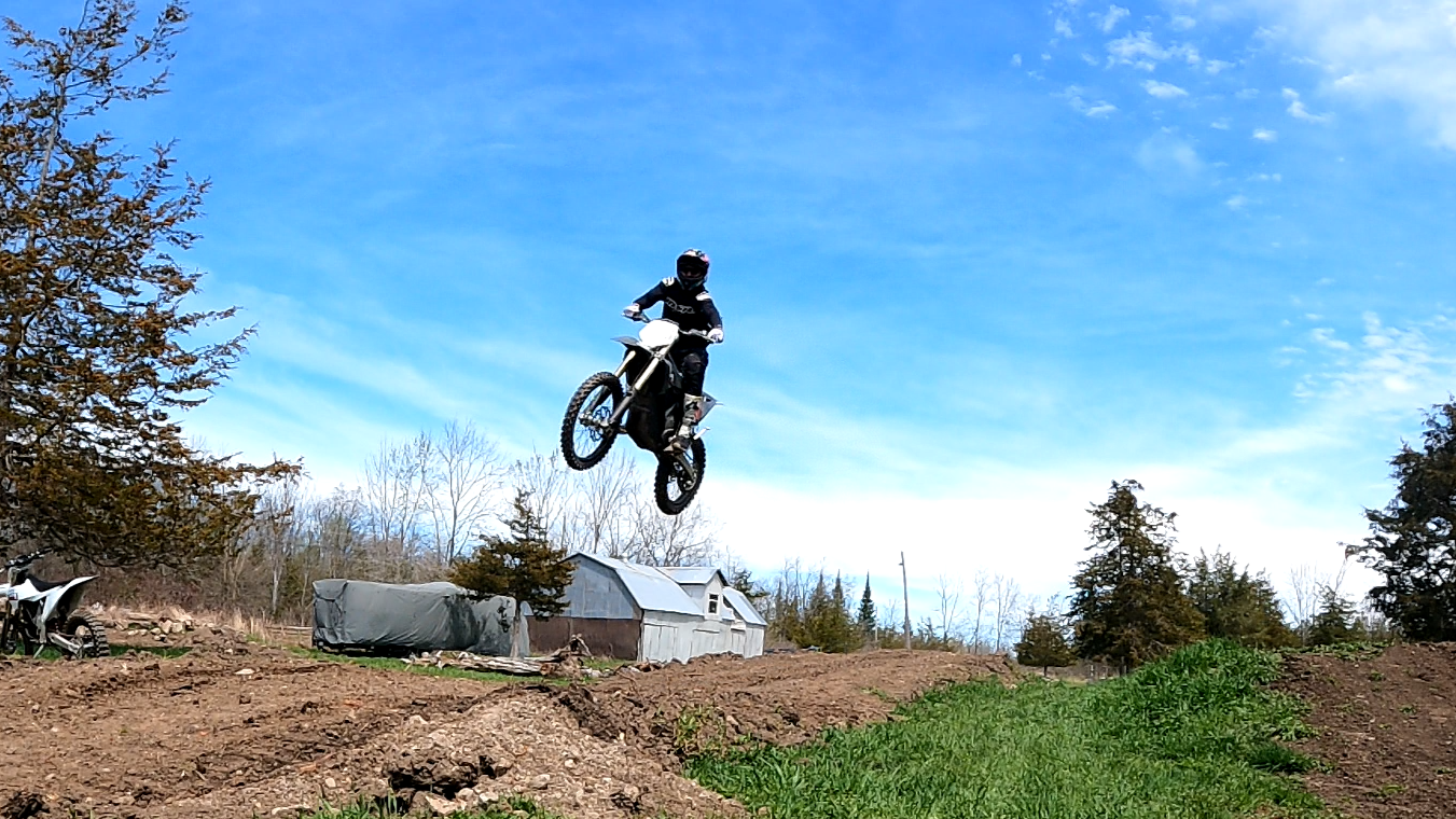 motorcross rider on a trail jump 