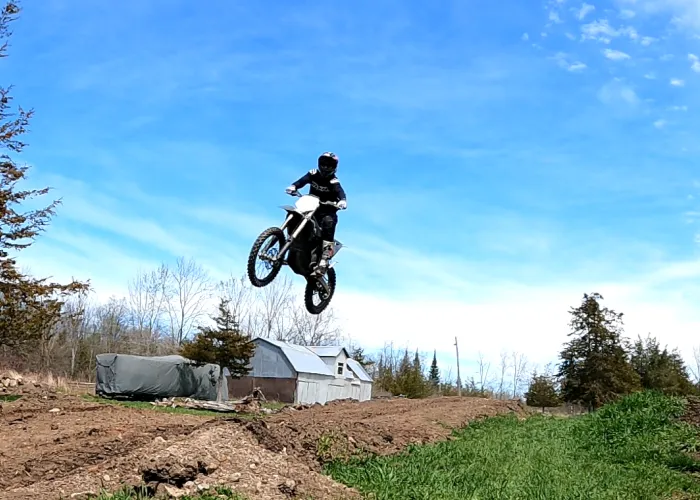 motorcross rider on a trail jump 