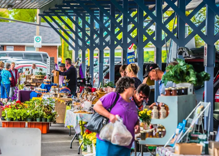 Photo of people shopping at an outdoor market